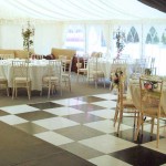 An image of a Wedding Marquee floor and chequered dance floor.