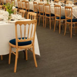 Inside of a marquee with rows of tables