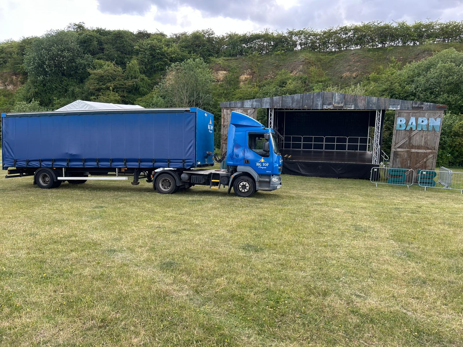 Lorry arriving to festival to drop off marquee